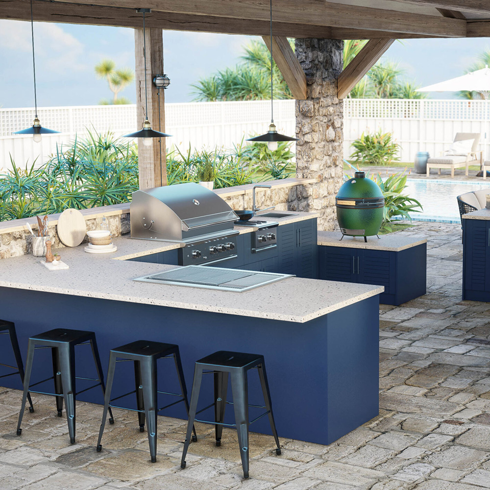 Outdoor kitchen with barbecue and blue stools